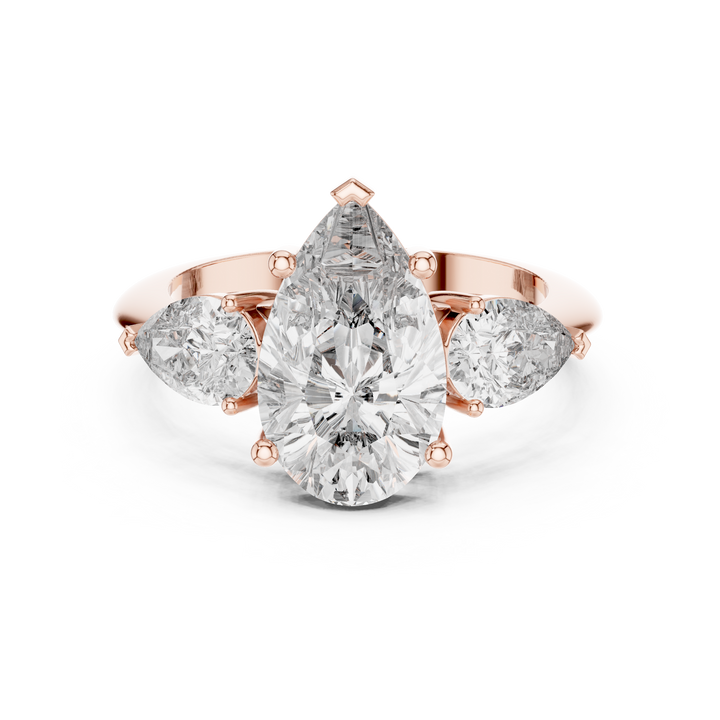 Pear Cut Three Stone Diamond Engagement Ring with Tapered Side Stones