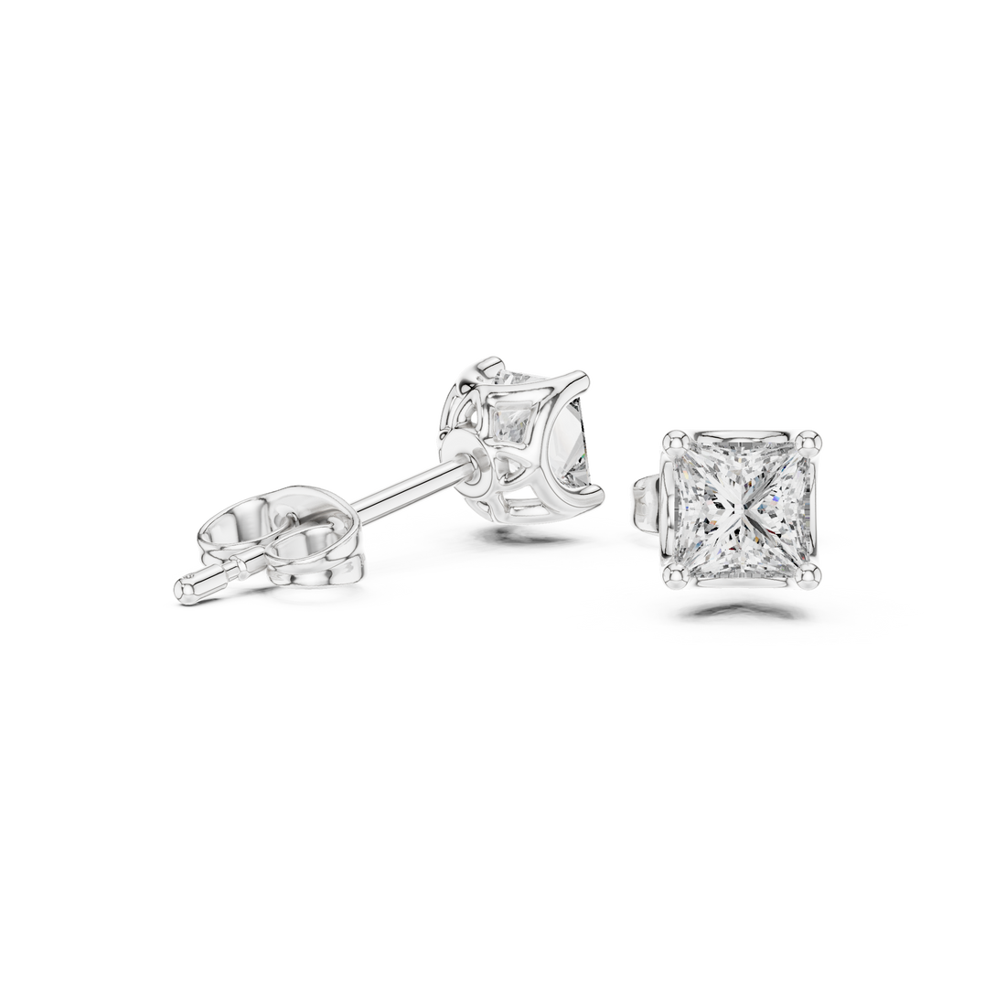 Close-up of princess cut diamond classic solitaire stud earrings detail