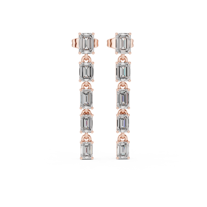 Emerald cut diamond linear drop earrings with linked station