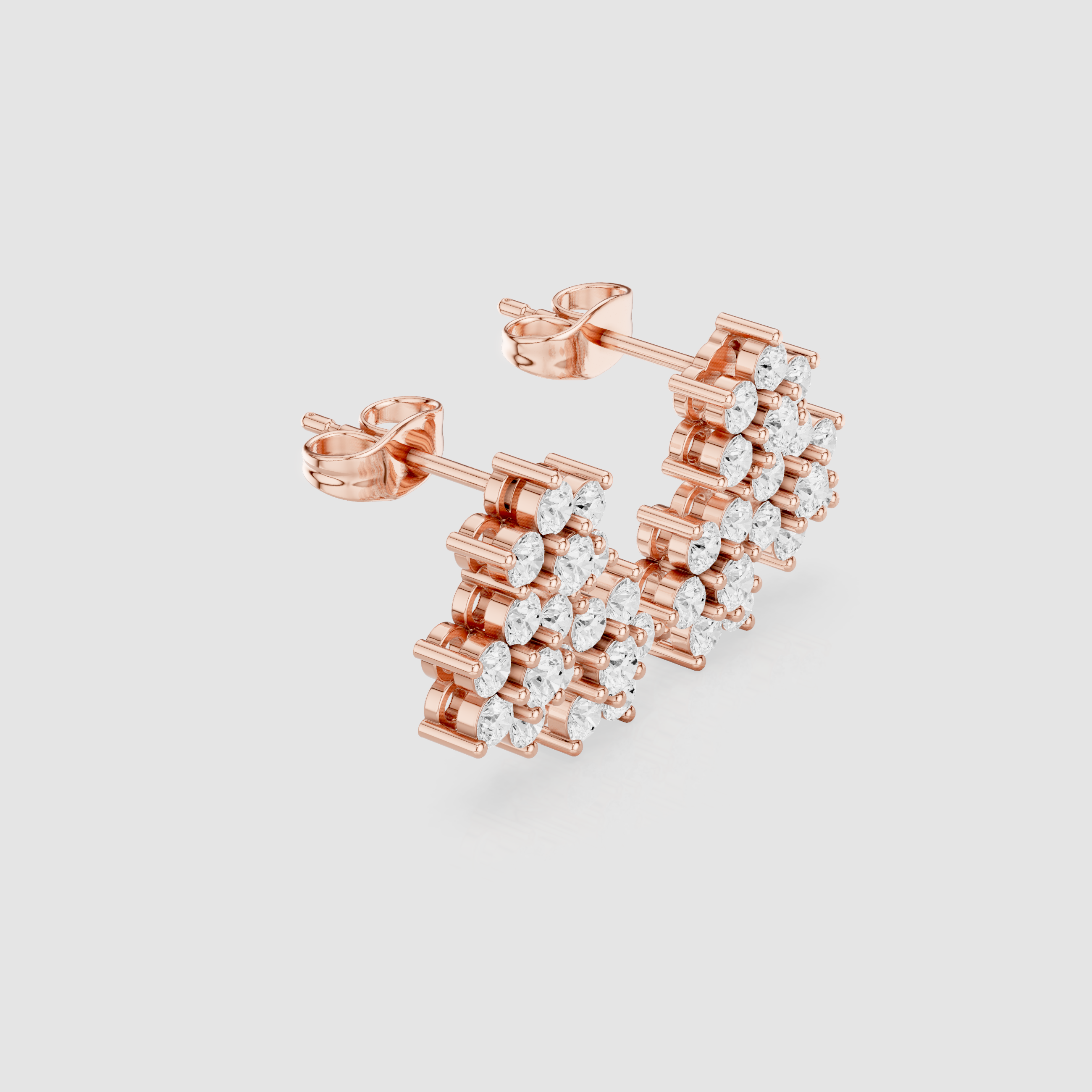 Luxury diamond jacket earrings designed to surround central stud stones.