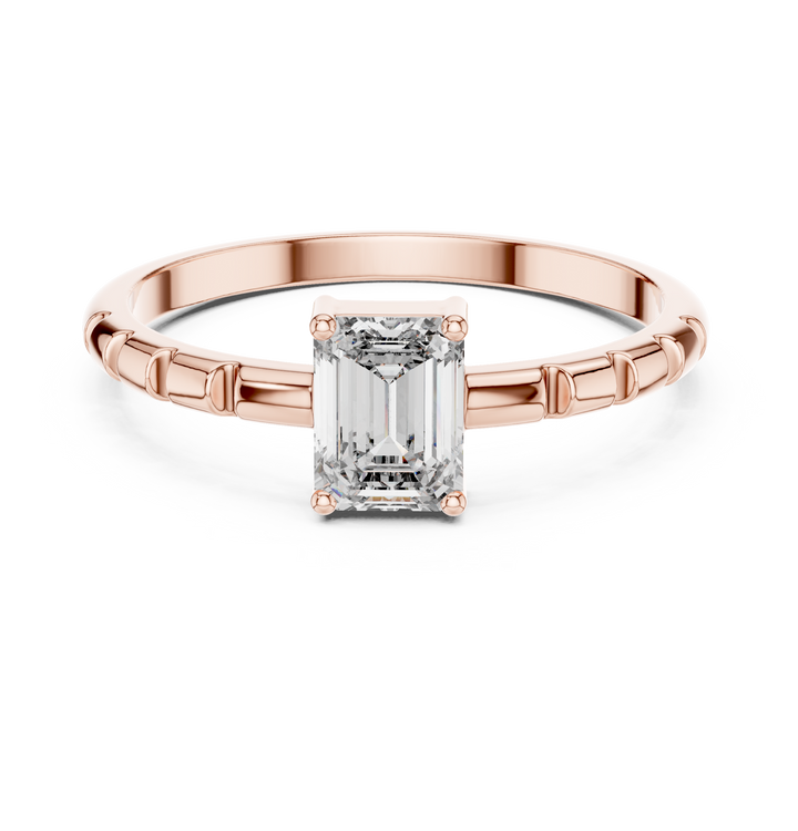 Diamond gemstone ring with sleek polished band.