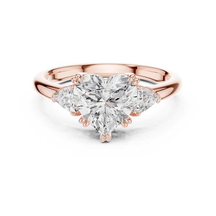 Sparkling Heart Cut Diamond Three Stone Engagement Ring with Trillion Side Stones close-up accent detail