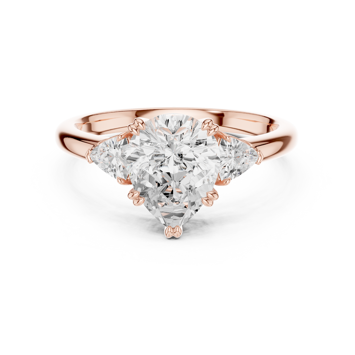 Sparkling Pear Cut Diamond Three Stone Engagement Ring with Trillion Side Diamonds close-up accent detail