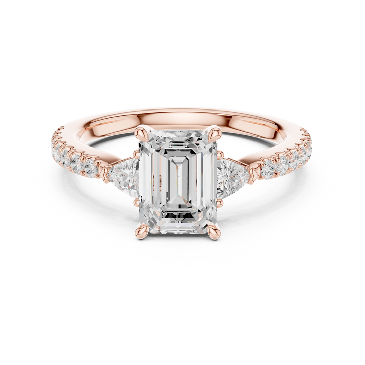 Sparkling Emerald Cut Diamond Three Stone Engagement Ring with Trillion Side Diamonds close-up accent detail