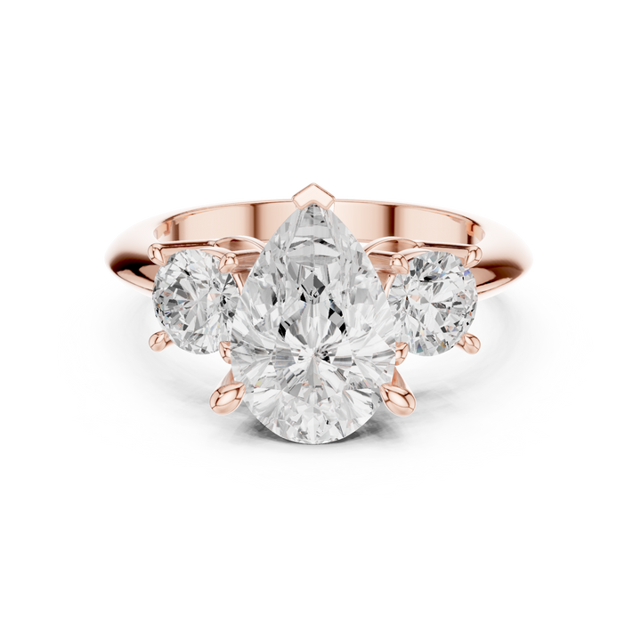 Sparkling Pear Cut Diamond Three Stone Engagement Ring with Round Side Diamonds close-up accent detail