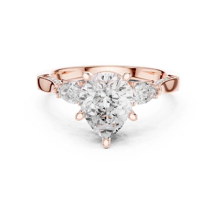 Timeless Pear Cut Diamond Three Stone Engagement Ring with Tapered Pear Side Diamonds accent stones classic look