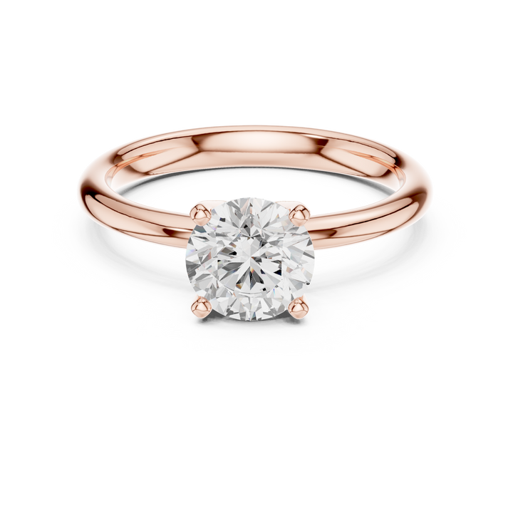 Elegant princess-cut diamond engagement ring with brilliant center stone and slim polished gold band.