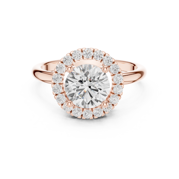 Elegant princess-cut diamond engagement ring with brilliant center stone and slim polished gold band.