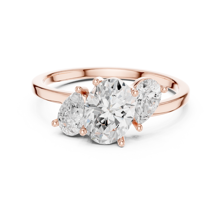 Oval and Pear Three Stone Diamond Ring with Classic Elegance