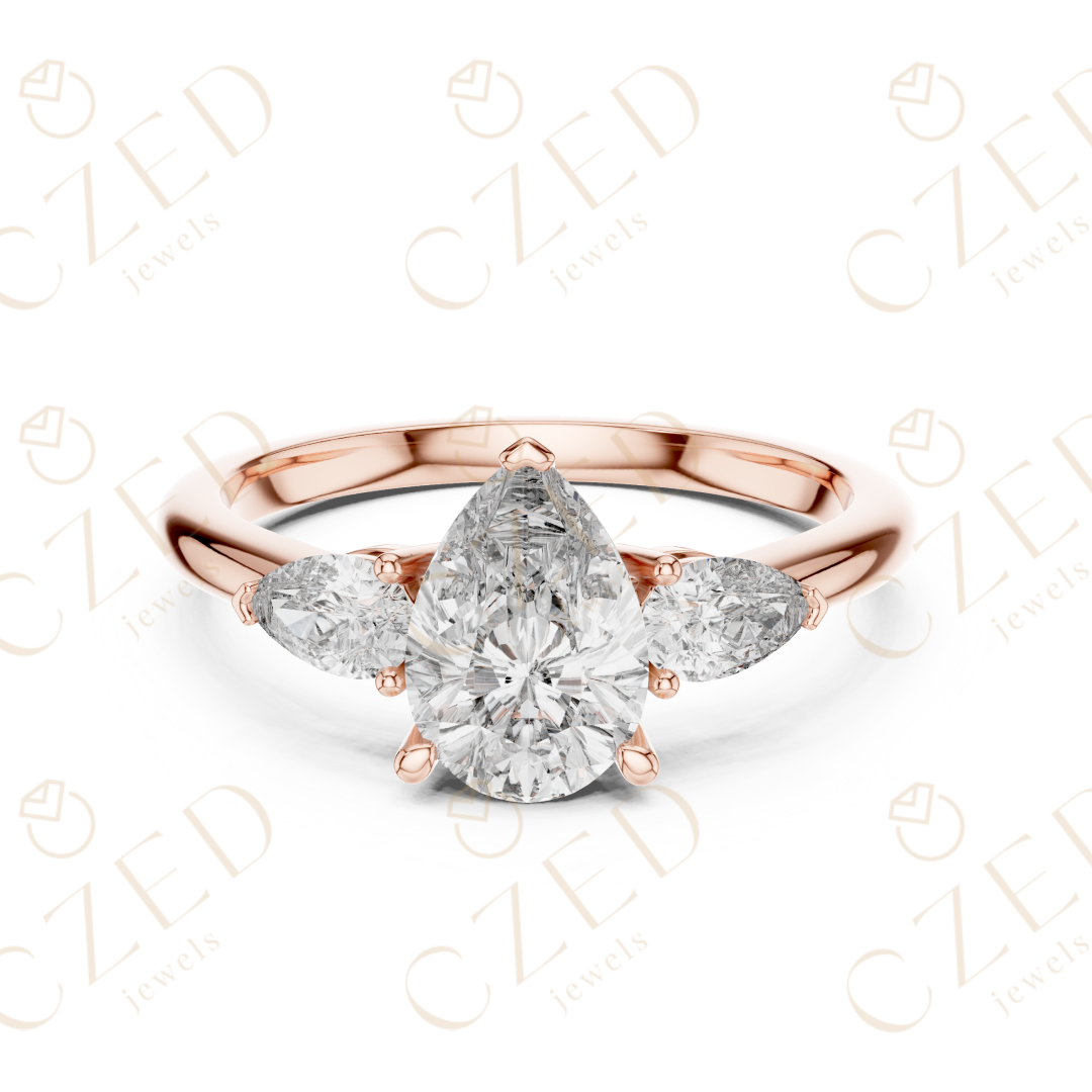 Pear Cut Diamond Three Stone Ring with Tapered Side Stones