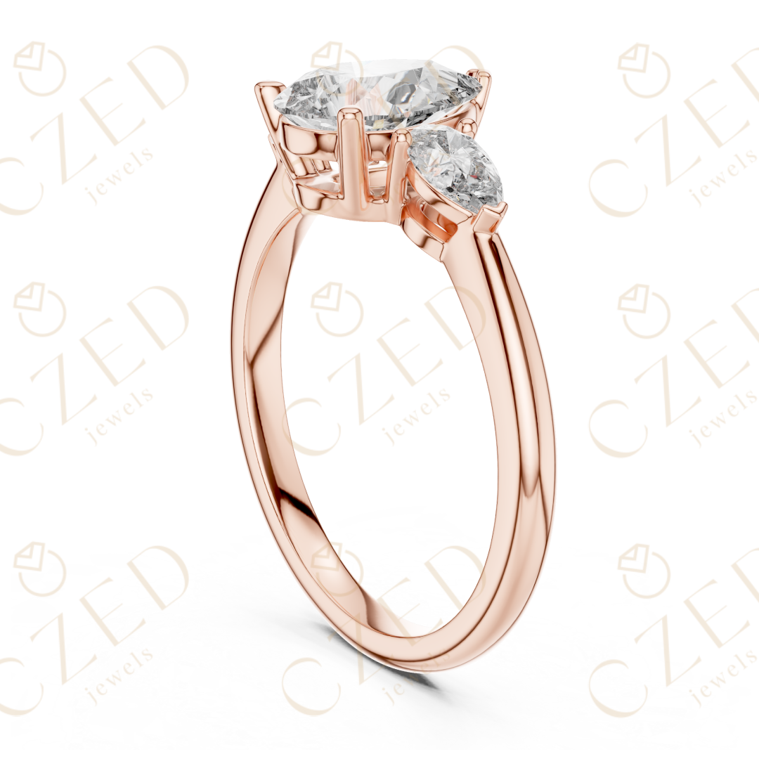 Pear Cut Diamond Three Stone Ring with Tapered Side Stones