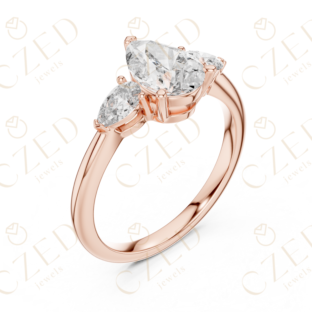 Pear Cut Diamond Three Stone Ring with Tapered Side Stones