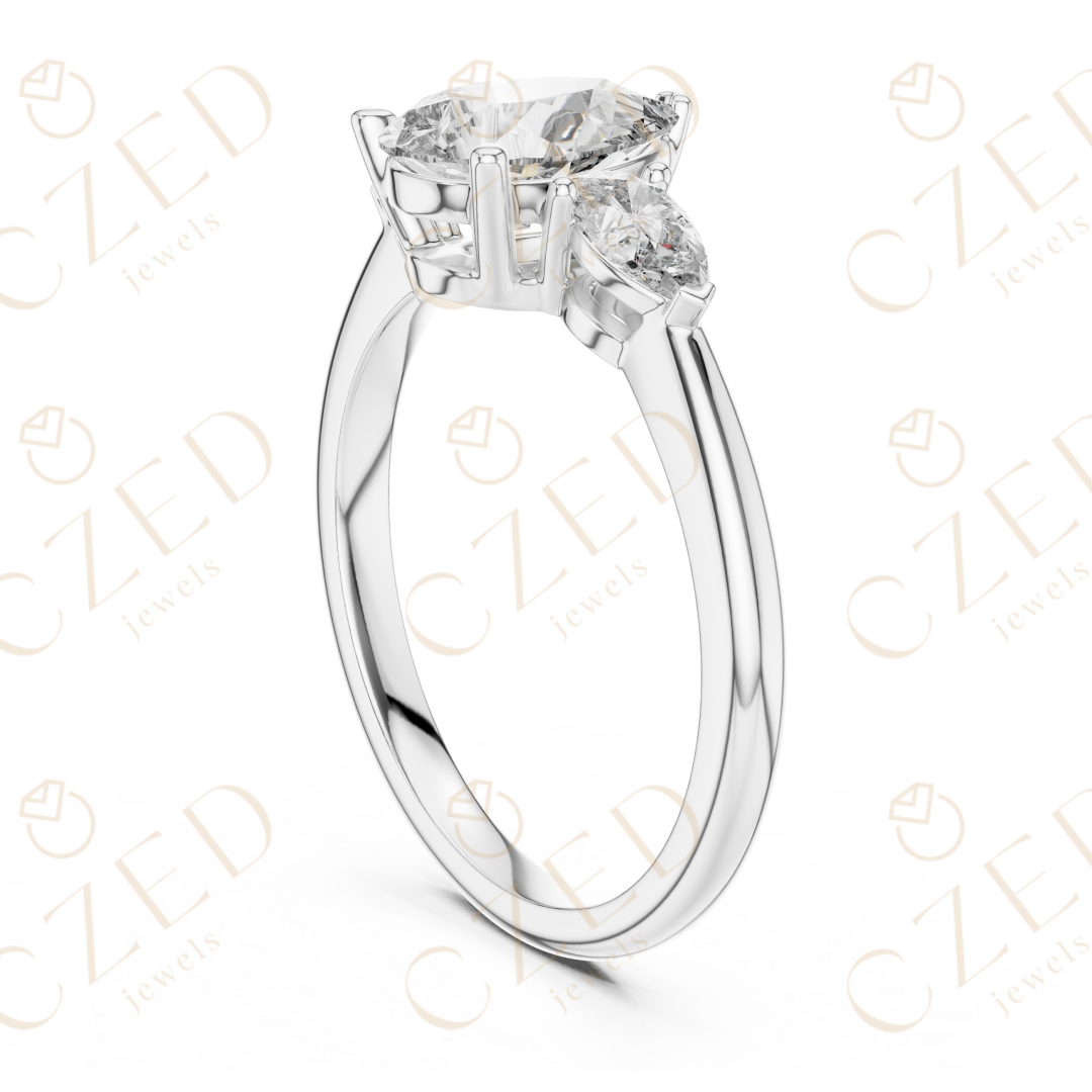 Pear Cut Diamond Three Stone Ring with Tapered Side Stones