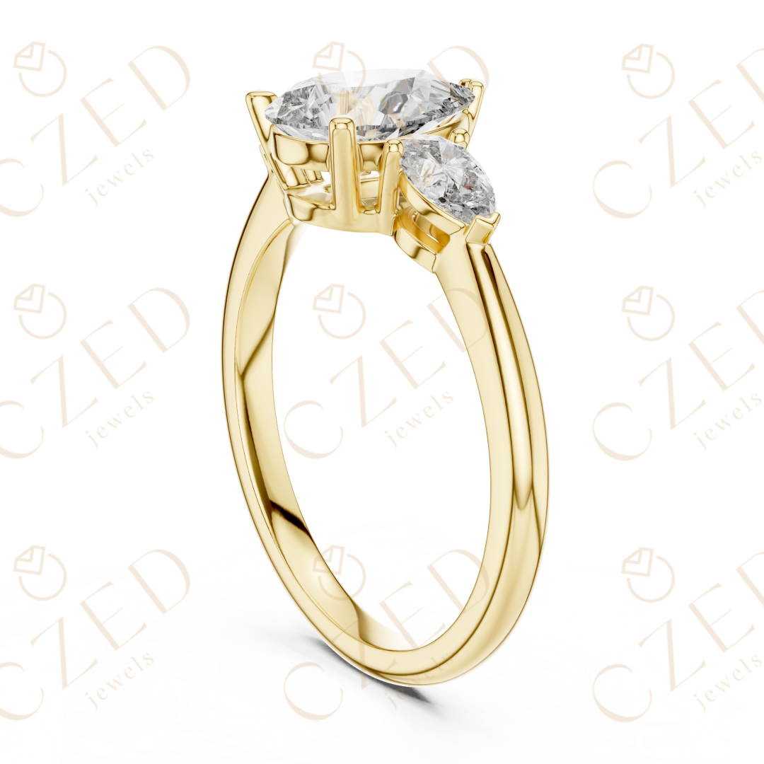 Pear Cut Diamond Three Stone Ring with Tapered Side Stones