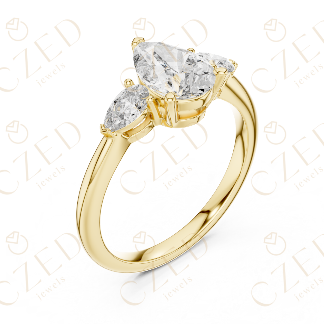 Pear Cut Diamond Three Stone Ring with Tapered Side Stones
