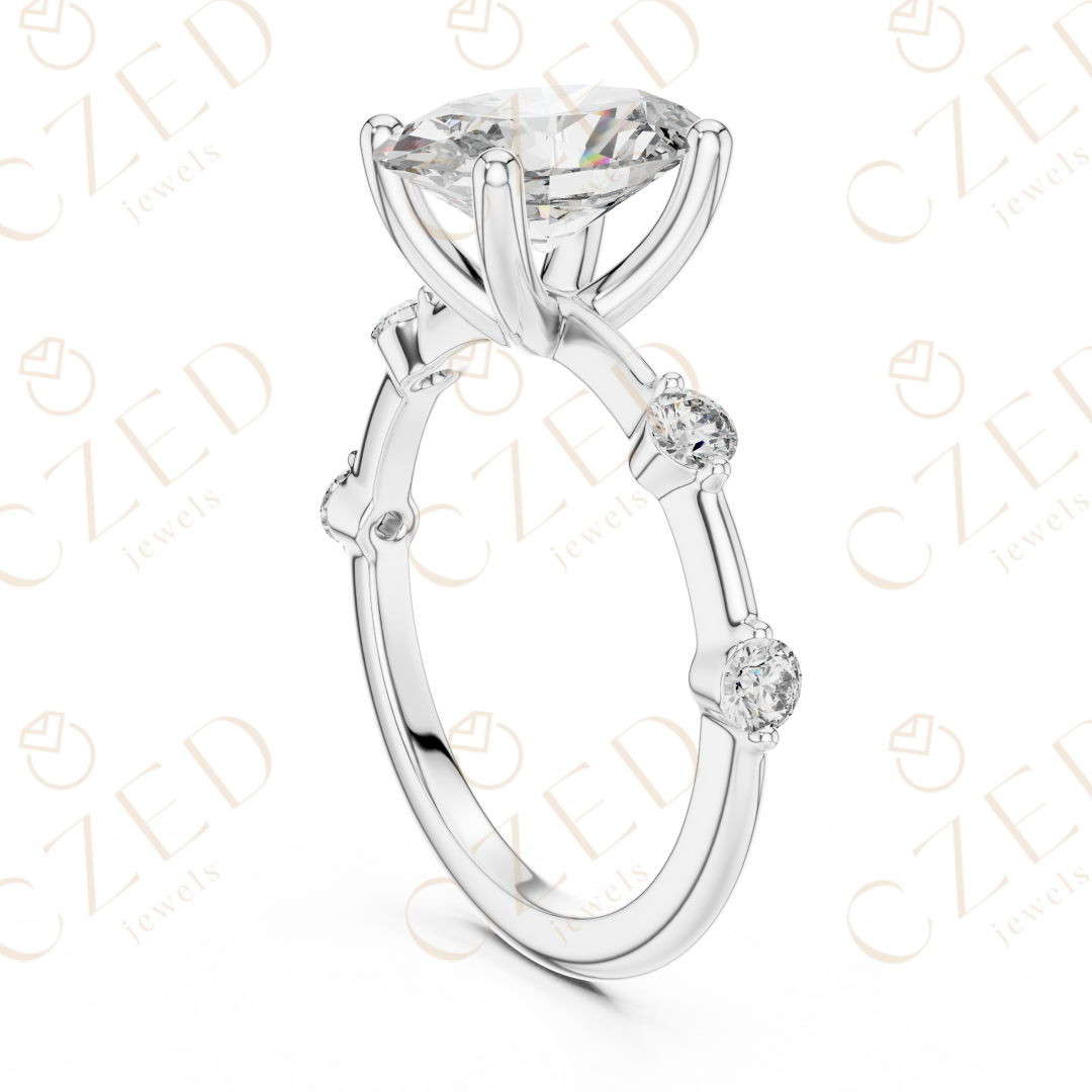 Oval Cut Diamond Ring with Round Side Stone Accents