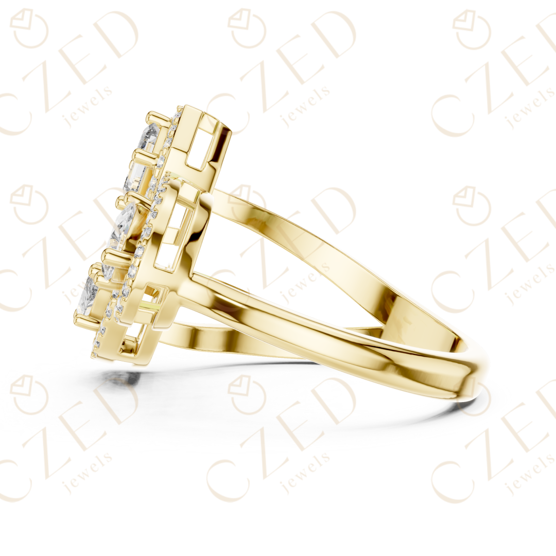 Emerald, Marquise and Pear Cut Diamond Three Stone Halo Ring